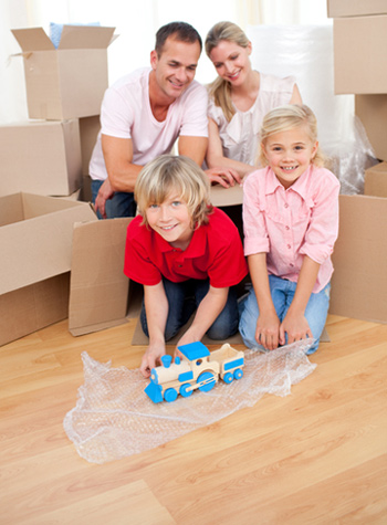 Family with Children Packing for Move